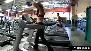 Sexy sporty girl teasing boobs while working out