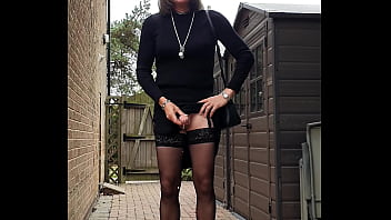 Rosemary Times masturbating outside in an elegant black dress & black underwear with a pink vibrator in my bottom, finishing with a nice cumshot